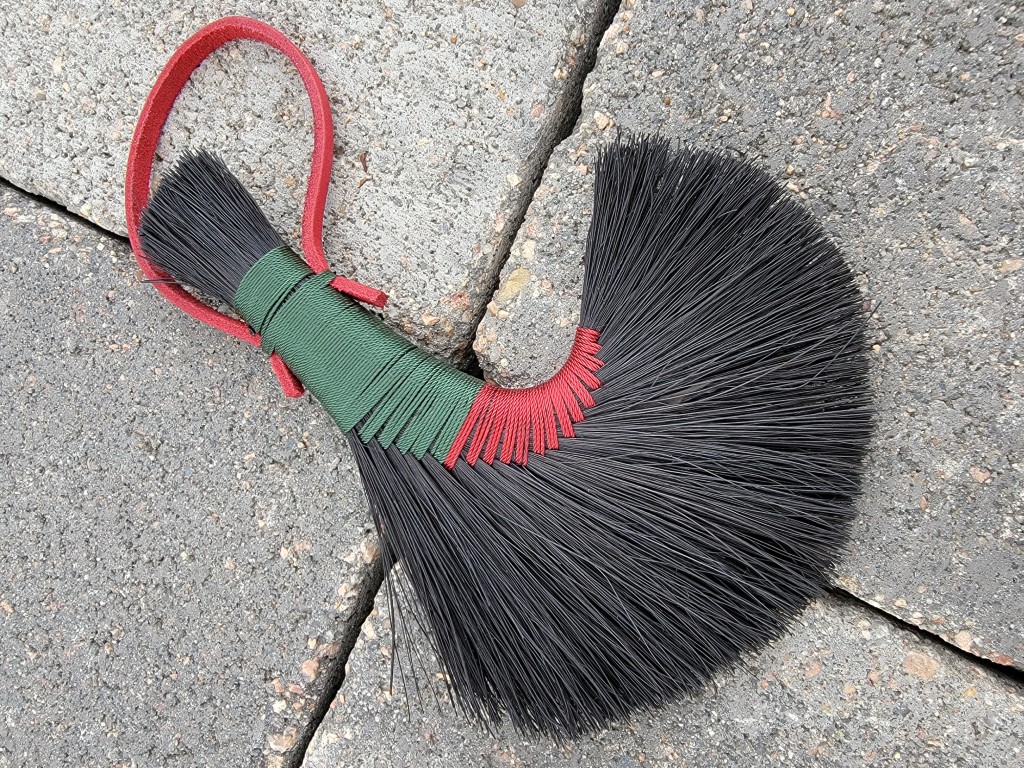Overview of broom with a focus on shape of curved sweep