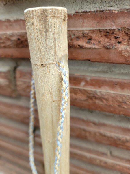 Plant stalk broomstick and handmade rope hangtag